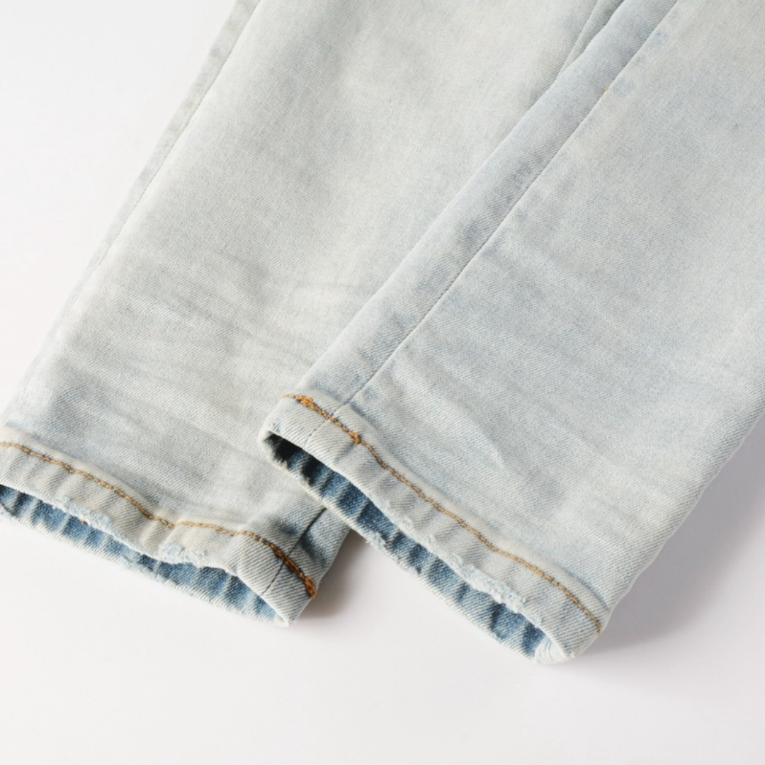 Light Wash Staggered Rip Jeans