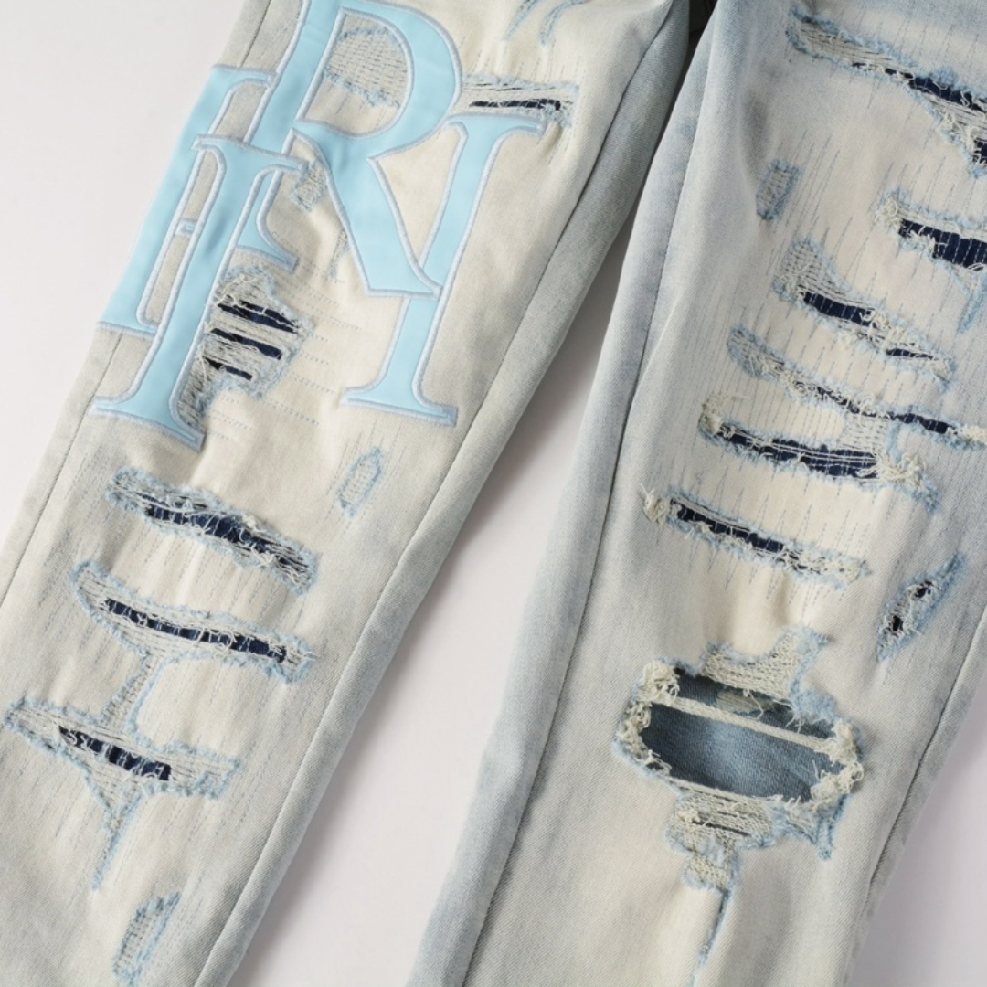 Light Wash Staggered Rip Jeans